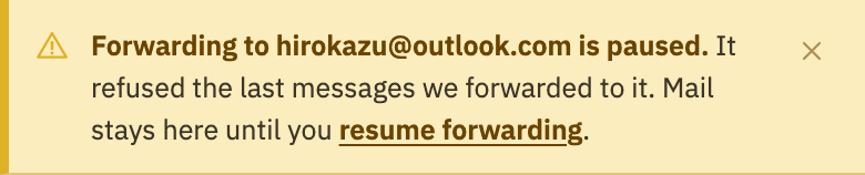 The notice: forwarding to an address is paused, with its resume forwarding link